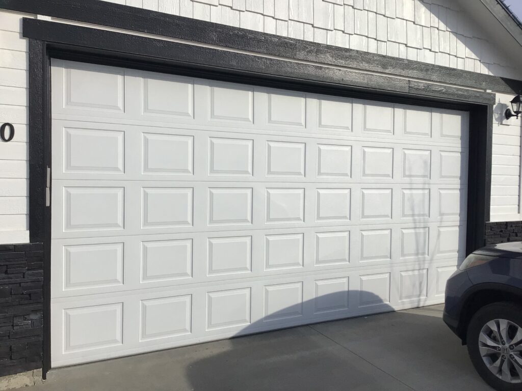 White traditional short panel garage door